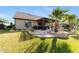 Landscaped backyard with patio, pergola, and lush greenery at 9551 Sw 70Th Loop, Ocala, FL 34481