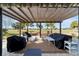 Covered patio with pergola, outdoor furniture, and golf course view at 9551 Sw 70Th Loop, Ocala, FL 34481