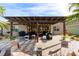 Spacious patio with pergola, outdoor seating, and grill area at 9551 Sw 70Th Loop, Ocala, FL 34481