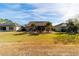 Home with solar panels, covered patio, and lush landscaping at 9551 Sw 70Th Loop, Ocala, FL 34481