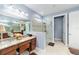 Spa-like bathroom with granite countertops and walk-in shower at 9551 Sw 70Th Loop, Ocala, FL 34481