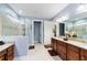 Elegant bathroom with dual vanities and a large walk-in shower at 9551 Sw 70Th Loop, Ocala, FL 34481