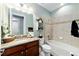 Bathroom with granite countertop, bathtub, and tile flooring at 9551 Sw 70Th Loop, Ocala, FL 34481