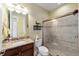 Bathroom with granite countertop, walk-in shower, and tile flooring at 9551 Sw 70Th Loop, Ocala, FL 34481