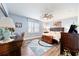 Spacious bedroom with hardwood floors, large window, and ceiling fan at 9551 Sw 70Th Loop, Ocala, FL 34481