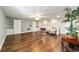 Bright bonus room with hardwood floors, built-in shelving, and ceiling fan at 9551 Sw 70Th Loop, Ocala, FL 34481