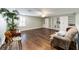 Spacious bonus room with hardwood floors, built-in shelving, and ceiling fan at 9551 Sw 70Th Loop, Ocala, FL 34481