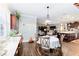 Open concept dining area with table and chairs, adjacent to kitchen and living room at 9551 Sw 70Th Loop, Ocala, FL 34481
