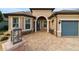 Inviting front entry with a stone walkway and charming landscaping at 9551 Sw 70Th Loop, Ocala, FL 34481
