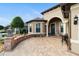 Brick paved patio area with lanterns, creating a welcoming entryway at 9551 Sw 70Th Loop, Ocala, FL 34481