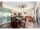 Gathering room with wet bar, hardwood floors, and view of kitchen at 9551 Sw 70Th Loop, Ocala, FL 34481