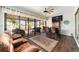 Gathering room with sliding doors, hardwood floors, and backyard access at 9551 Sw 70Th Loop, Ocala, FL 34481