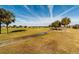 Golf course with palm trees and a paved walkway at 9551 Sw 70Th Loop, Ocala, FL 34481