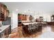 Open concept kitchen with large island, stainless steel appliances, and hardwood floors at 9551 Sw 70Th Loop, Ocala, FL 34481