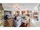 Open concept living space with hardwood floors and a cozy atmosphere at 9551 Sw 70Th Loop, Ocala, FL 34481