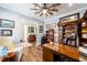 Spacious home office with large desk and built-in shelving at 9551 Sw 70Th Loop, Ocala, FL 34481