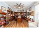 Home office with built-in bookcases and hardwood floors at 9551 Sw 70Th Loop, Ocala, FL 34481