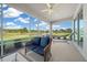 Screened patio with seating, hammock, and lush view at 9591 Sw 70Th Loop, Ocala, FL 34481