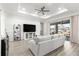 Living room with a gray sofa and sliding glass doors at 10589 Sw 98Th Ln, Ocala, FL 34481