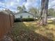 Side view of house exterior with fence and landscaping at 1510 Ne 17Th St, Ocala, FL 34470