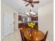 Bright dining room with wood table and kitchen view at 7524 Sw 101St Ct, Ocala, FL 34481