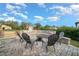 Comfortable backyard seating area with a fire pit and surrounding wall at 9175 Sw 65Th Loop, Ocala, FL 34481