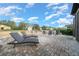 Private backyard with lounge chairs, fire pit area, and paver patio at 9175 Sw 65Th Loop, Ocala, FL 34481