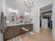 Elegant bathroom with dual vanities, a walk-in shower, and contemporary design at 9175 Sw 65Th Loop, Ocala, FL 34481