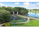 Stone Creek community entrance with waterfall feature and lush landscaping at 9175 Sw 65Th Loop, Ocala, FL 34481