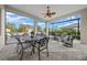 Relaxing covered patio perfect for outdoor entertaining, with a ceiling fan at 9175 Sw 65Th Loop, Ocala, FL 34481