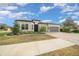 Beautiful one-story home with a three-car garage and landscaped yard at 9175 Sw 65Th Loop, Ocala, FL 34481