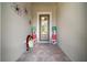 Foyer with a glass front door and holiday decor at 9175 Sw 65Th Loop, Ocala, FL 34481