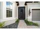 Screened front entryway with a glass front door at 9175 Sw 65Th Loop, Ocala, FL 34481