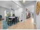 Game room featuring a poker table, ceiling fan, and view into the living area at 9175 Sw 65Th Loop, Ocala, FL 34481