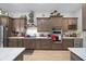 Modern kitchen featuring stainless steel appliances, ample counter space, and wood cabinets at 9175 Sw 65Th Loop, Ocala, FL 34481