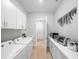Spacious laundry room with white cabinets, washer, dryer, and additional counter space at 9175 Sw 65Th Loop, Ocala, FL 34481
