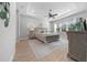 Spacious main bedroom with a ceiling fan, plush carpet, and stylish decor at 9175 Sw 65Th Loop, Ocala, FL 34481