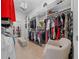 Organized walk-in closet with built-in shelving, drawers, and hanging rods at 9175 Sw 65Th Loop, Ocala, FL 34481