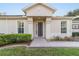 Front entrance with walkway and manicured landscaping at 9570 Sw 70Th Loop, Ocala, FL 34481