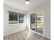 Dining area with sliding door access to backyard and laminate flooring at 9756 Sw 94Th Ter # B, Ocala, FL 34481