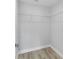 Walk-in closet with wire shelving and wood-look flooring at 10162 Sw 137 Ave, Dunnellon, FL 34432