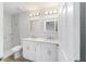 Modern bathroom with dual vanity, marble tile shower, and updated fixtures at 10178 Sw 137 Ave, Dunnellon, FL 34432