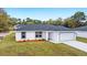 Single-story home exterior with front yard landscaping at 10178 Sw 137 Ave, Dunnellon, FL 34432