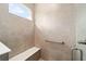 Walk-in shower with built-in seat and grab bar at 10314 Sw 99Th Ln, Ocala, FL 34481