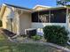 Home's side view, showing AC unit and landscaping at 10819 Sw 84Th Ter, Ocala, FL 34481