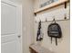 Functional mudroom with bench and hooks for storage at 3099 Canopy Oak Blvd, Wildwood, FL 34785