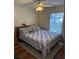 Bright bedroom with wood floors and ceiling fan at 35 Hemlock Terrace Dr, Ocala, FL 34472