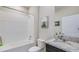 Clean bathroom with a tub, toilet and granite countertop vanity at 4122 Nw 48Th Terrace Rd, Ocala, FL 34482