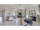 Open concept dining and living area with neutral tones and large windows at 4122 Nw 48Th Terrace Rd, Ocala, FL 34482