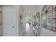 Bright and airy entryway with tile flooring and decorative mirrors at 4122 Nw 48Th Terrace Rd, Ocala, FL 34482